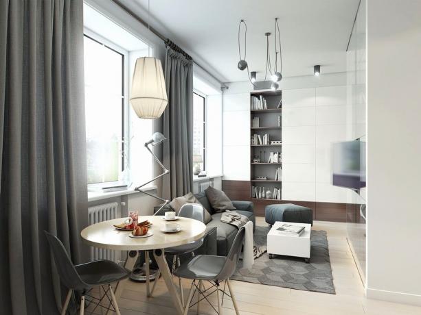 Appartement moderne 32 m² avec des murs en verre et un lit